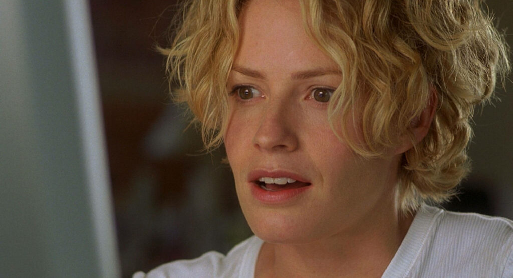 Elisabeth Shue close-up with natural lighting tousled blonde hair cinematic soft tones wallpaper