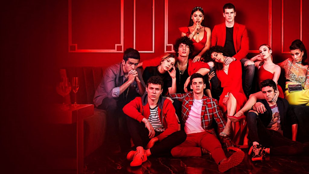 Elite Season 4 cast in red lit lounge wearing edgy fashion posing confidently in dark shadows Wallpaper