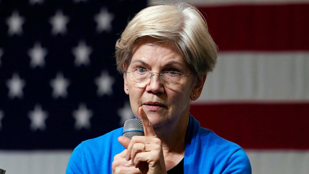 Elizabeth Warren speaking passionately with microphone American flag backdrop leadership political engagement Wallpaper