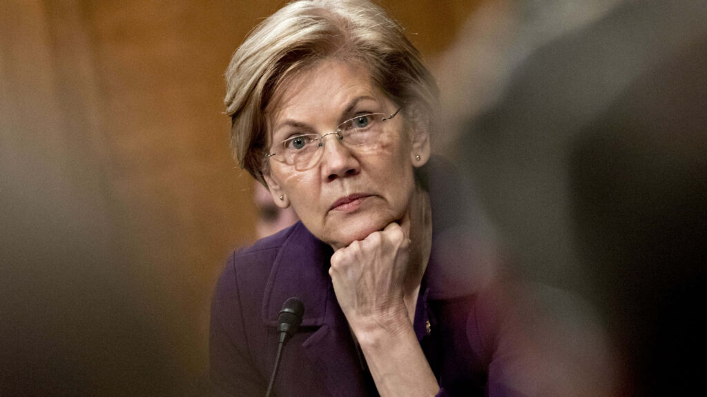 Elizabeth Warren thoughtful portrait wallpaper with warm tones professional leadership background