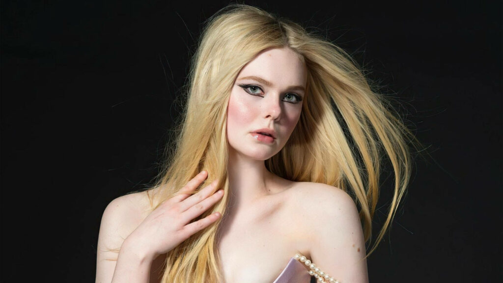 Elle Fanning: Fierce Expression & Bold Makeup Wallpaper Background