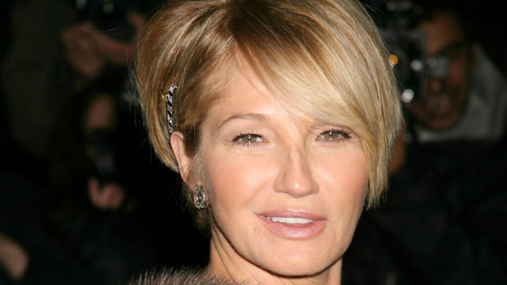 Ellen Barkin portrait with short blonde hair soft makeup elegant accessories blurred background Wallpaper