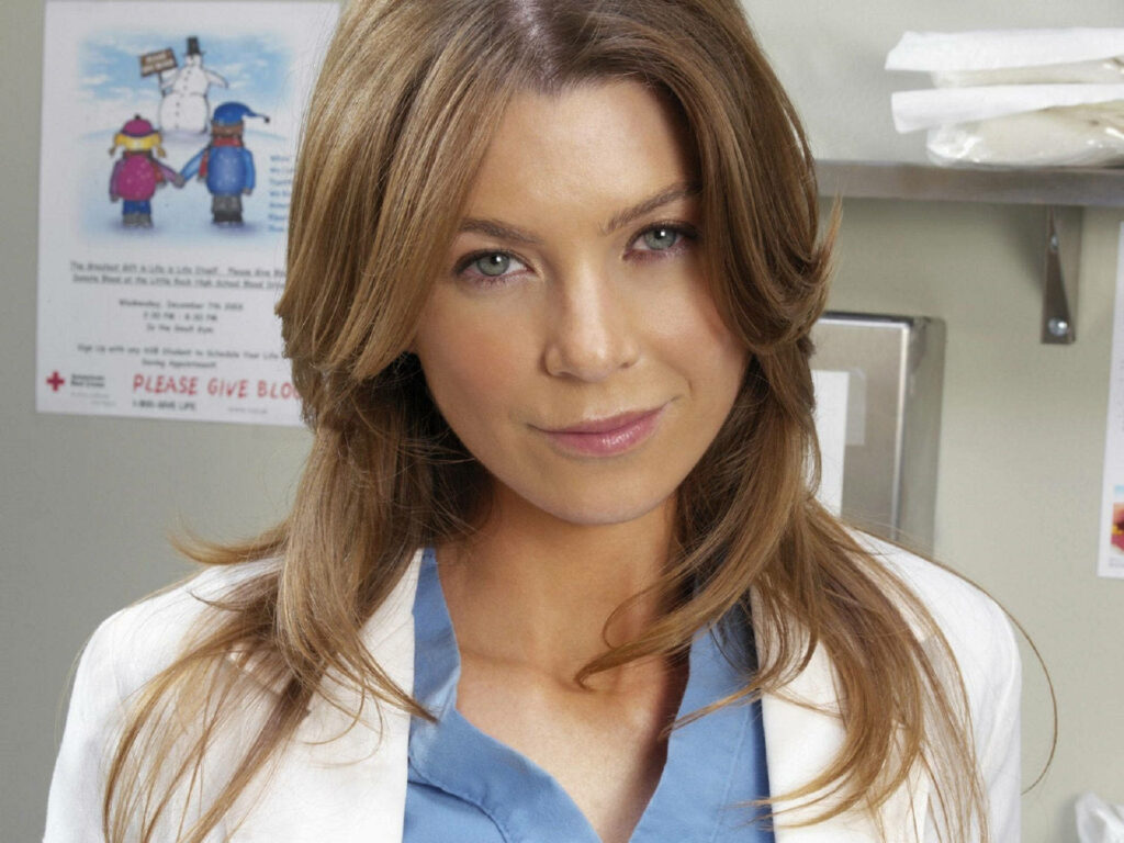 Ellen Pompeo close-up with natural makeup in medical attire calm confident hospital background wallpaper