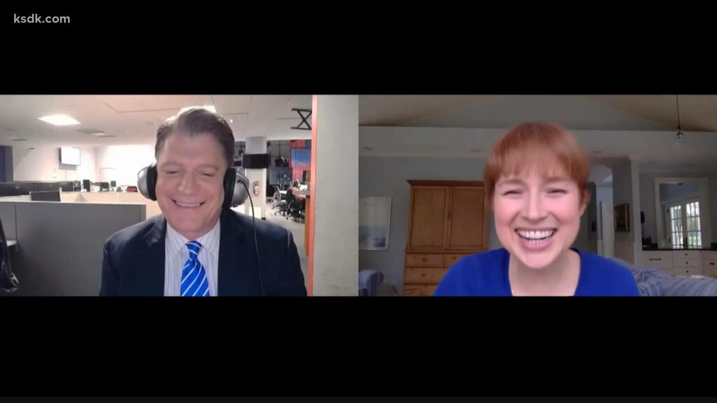 Ellie Kemper smiling in cozy room during pandemic virtual interview with split-screen background Wallpaper