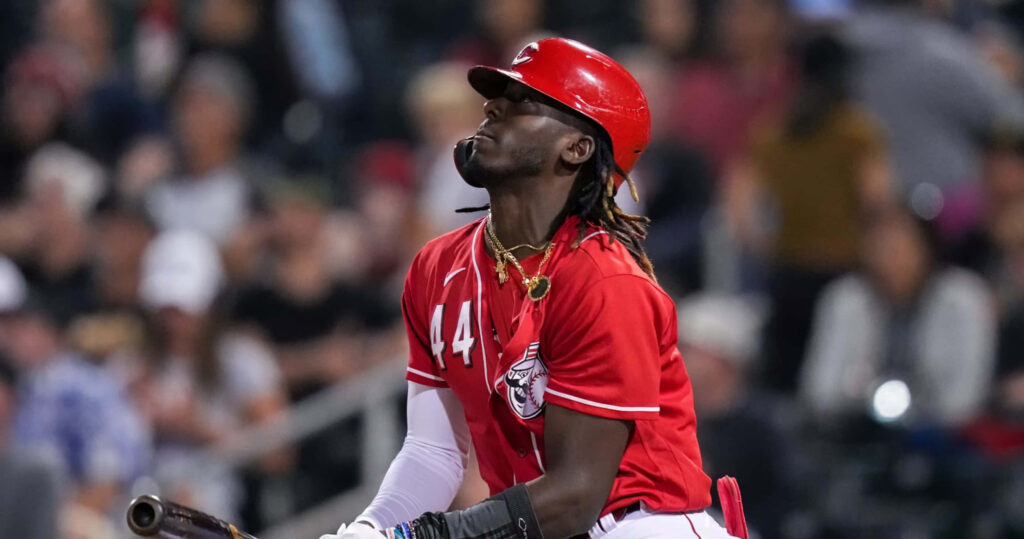 Elly De La Cruz Cincinnati Reds player in red uniform batting with focused expression wallpaper