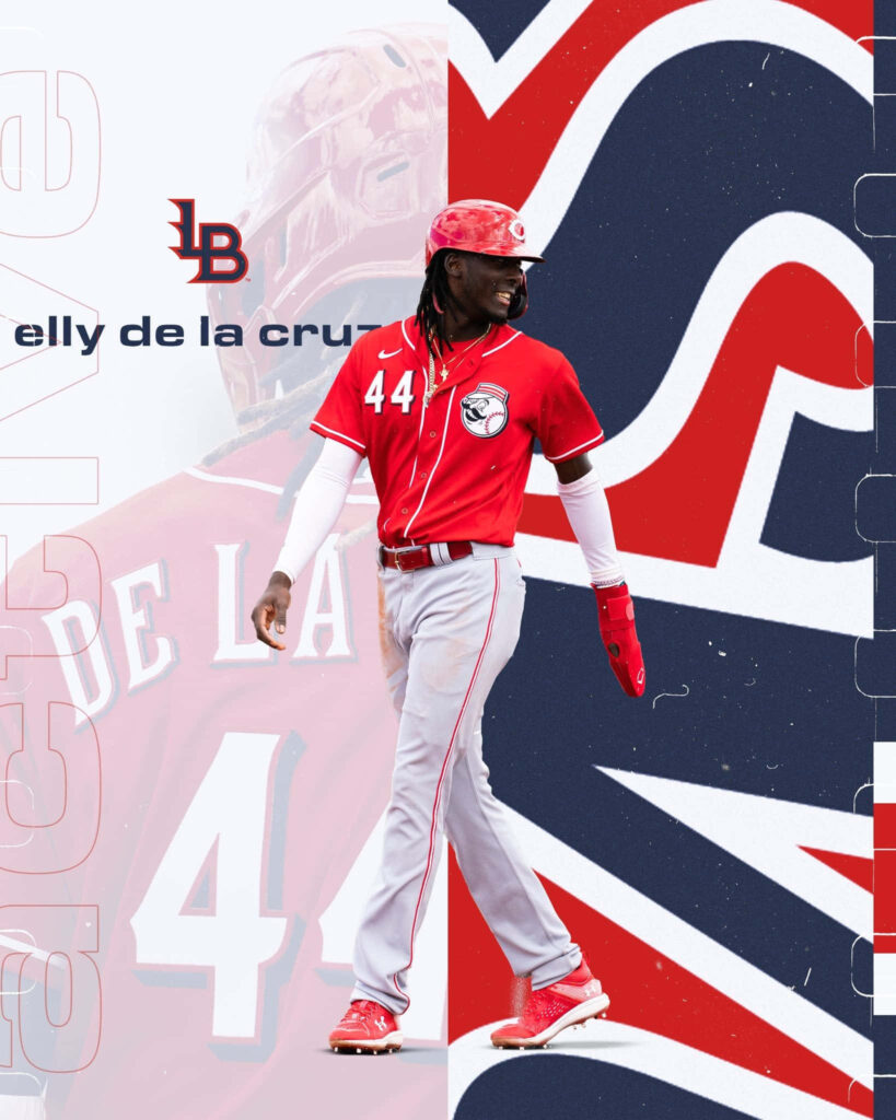 Elly De La Cruz in Reds uniform with bold red white navy background modern sports wallpaper
