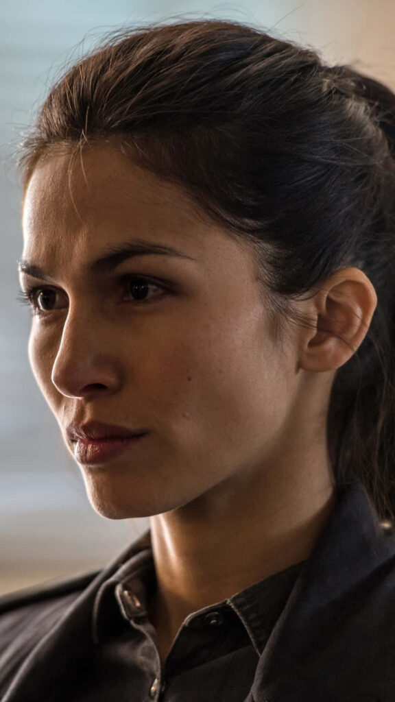 Close-up portrait of Elodie Yung from Daredevil with intense expression and soft lighting wallpaper