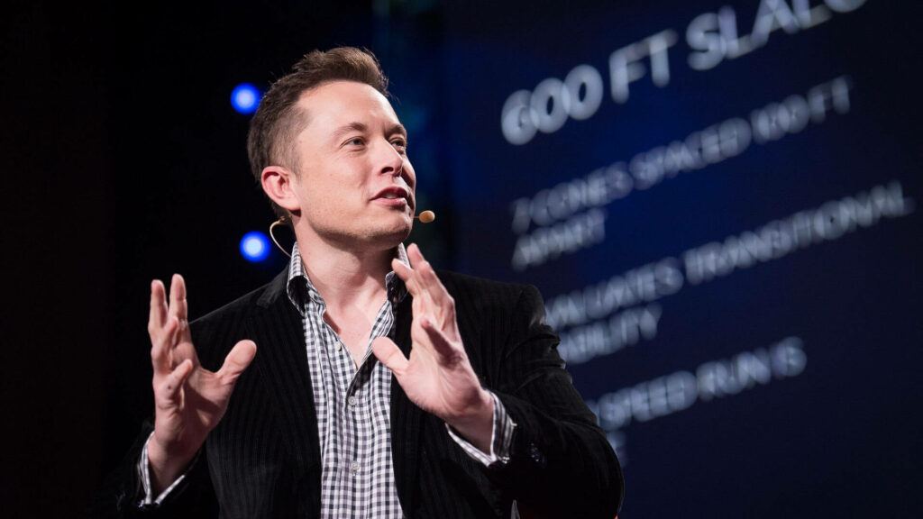 Dynamic Elon Musk Lecture Wallpaper: Inspiring Entrepreneur Moment