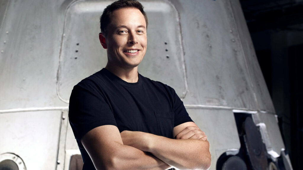 Elon Musk Wallpaper: Innovator Against a Spacecraft Backdrop