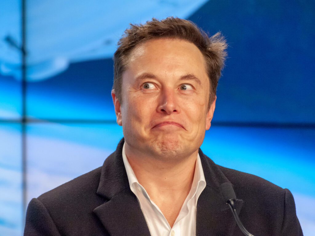 Elon Musk Press Conference Wallpaper: Space-Themed Innovation Background