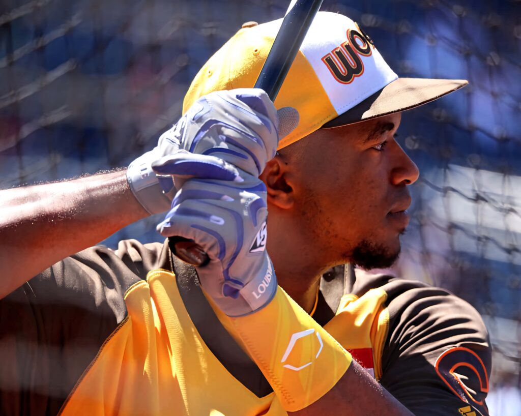 Eloy Jiménez baseball wallpaper dynamic profile bat focus yellow brown team colors background