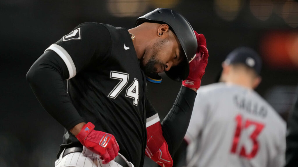 Eloy Jiménez in black white Chicago White Sox uniform number 74 batting intense focused pose Wallpaper