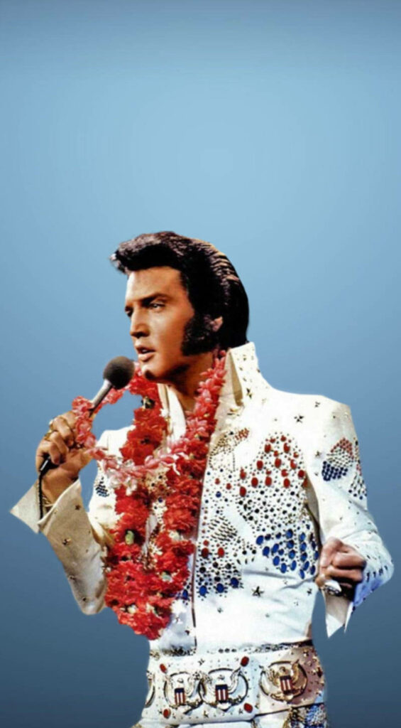 Elvis Presley in jeweled white jumpsuit with red lei holding microphone vintage blue background Wallpaper
