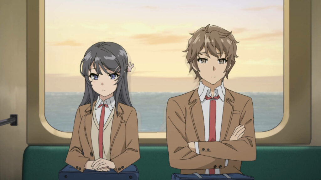 Bunny Girl Senpai Anime Characters Sitting on Train with Ocean View Wallpaper