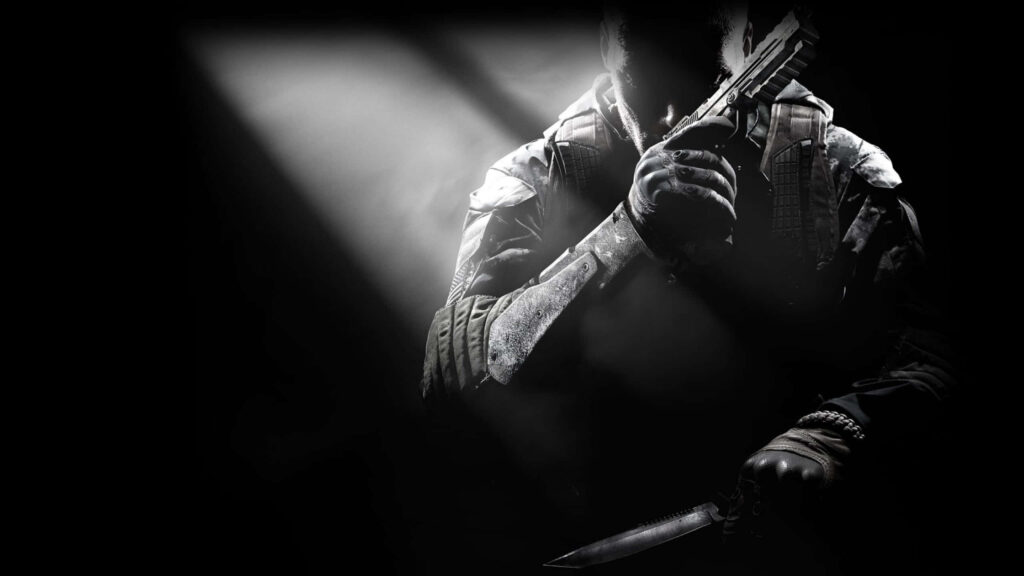 Call of Duty: Black Ops II soldier in shadow with combat knife and firearm on dramatic monochrome wallpaper