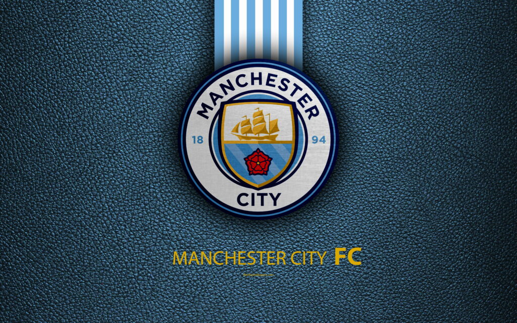 The Iconic Emblem of Manchester City FC: A Premier League Powerhouse Unveiling Its Historical Role in English Football Wallpaper