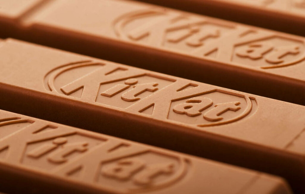 Tempting Close-up of Kit Kat Bars with Embossed Logo Wallpaper