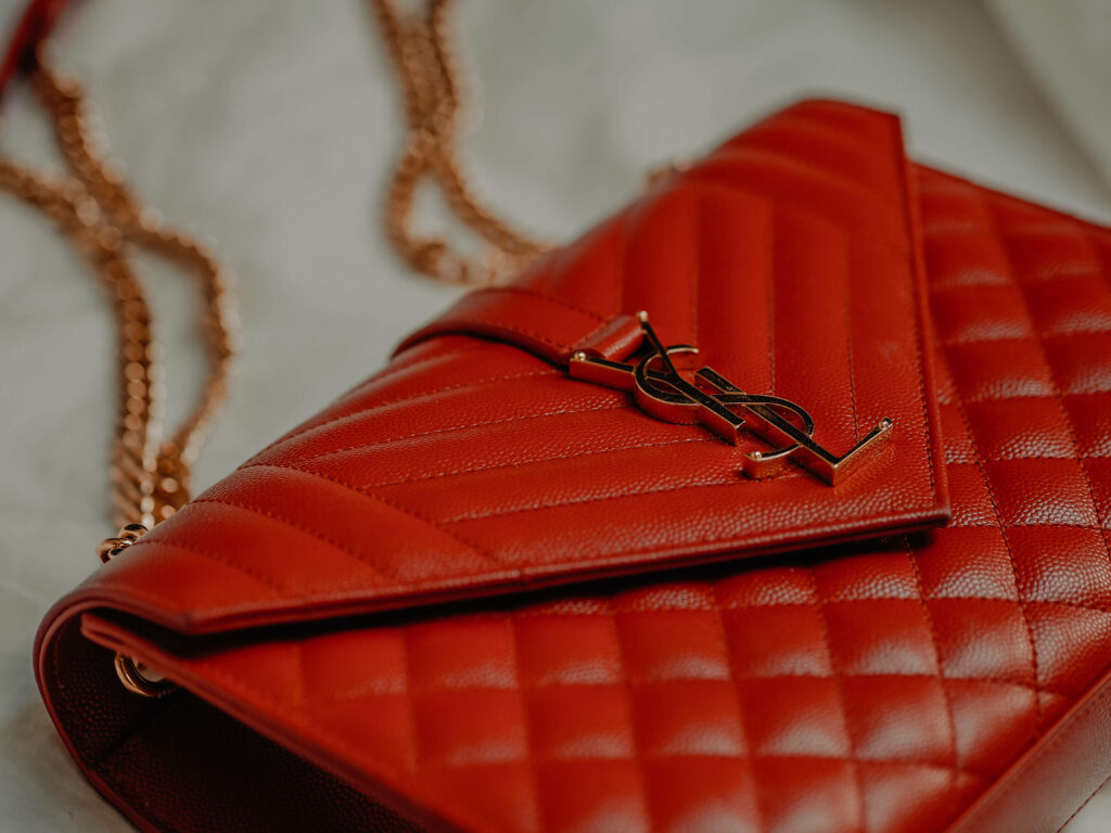 Timeless Sophistication: Elevate Your Look with the Iconic Red YSL Bag Wallpaper