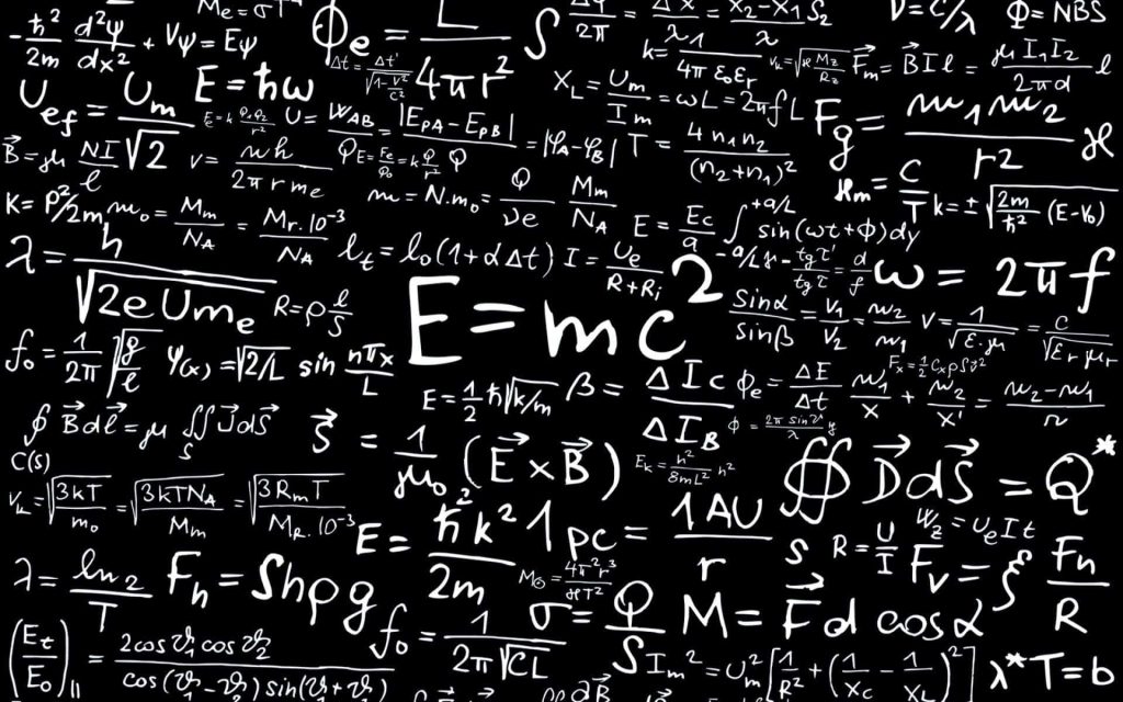 Academic wallpaper with complex physics formulas and E=mc2 on dark blackboard background
