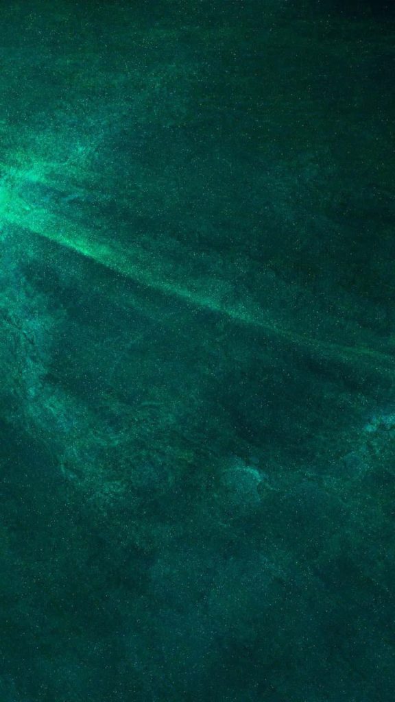 Vibrant emerald green abstract wallpaper with rich texture and dark ethereal minimalist background