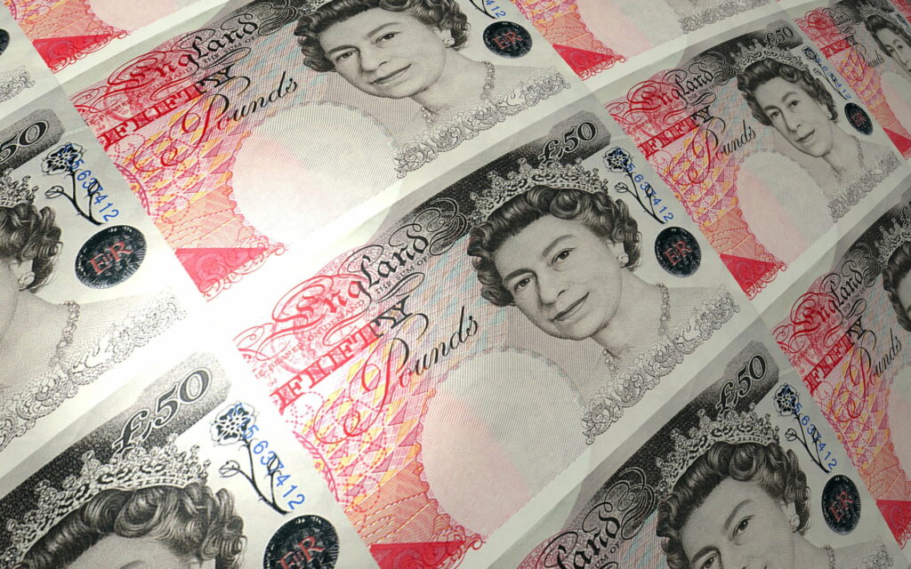 Fortune in Pounds: Explore a QHD Wallpaper with Banknotes in Currency Concepts
