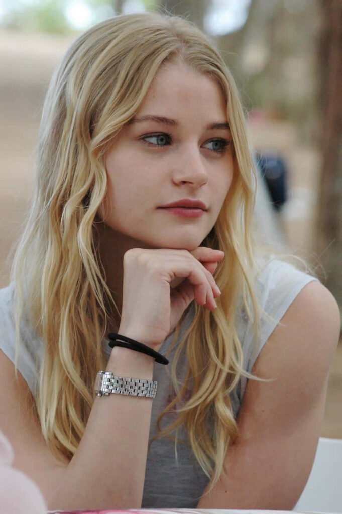 Emilie de Ravin candid portrait with natural light long blonde hair earth tone serene background Wallpaper