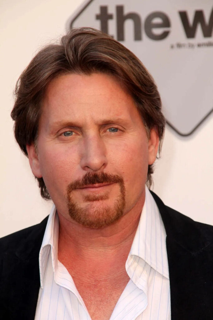 Close-up portrait of Director Emilio Estevez at The Way screening in classic blazer and soft background Wallpaper