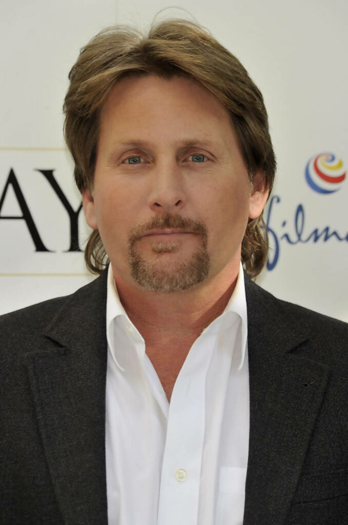 Emilio Estevez close-up portrait at The Way photocall with sharp suit and calm expression background Wallpaper