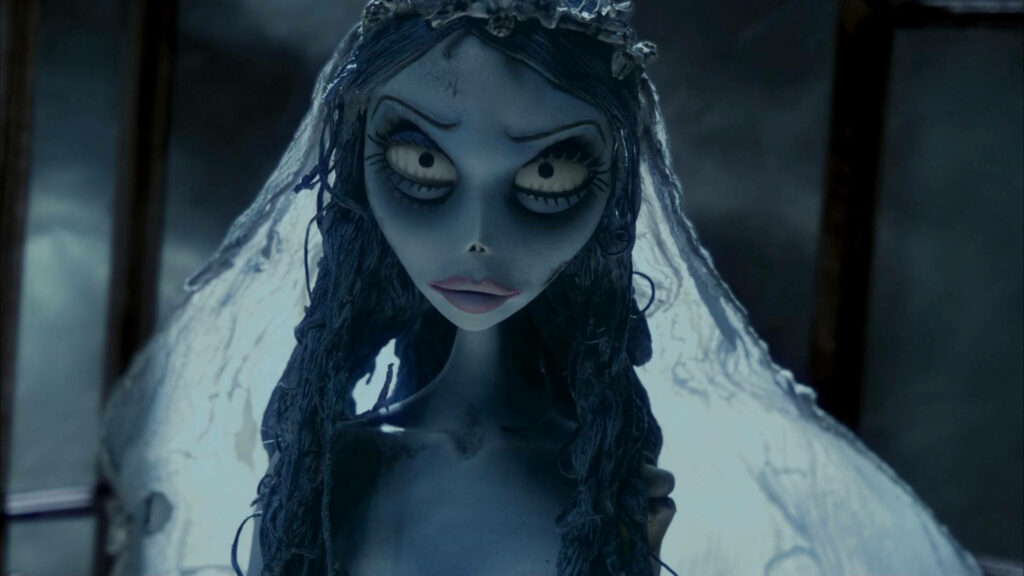 Emily the Corpse Bride with angry expression pale blue skin gothic wedding veil dark wallpaper