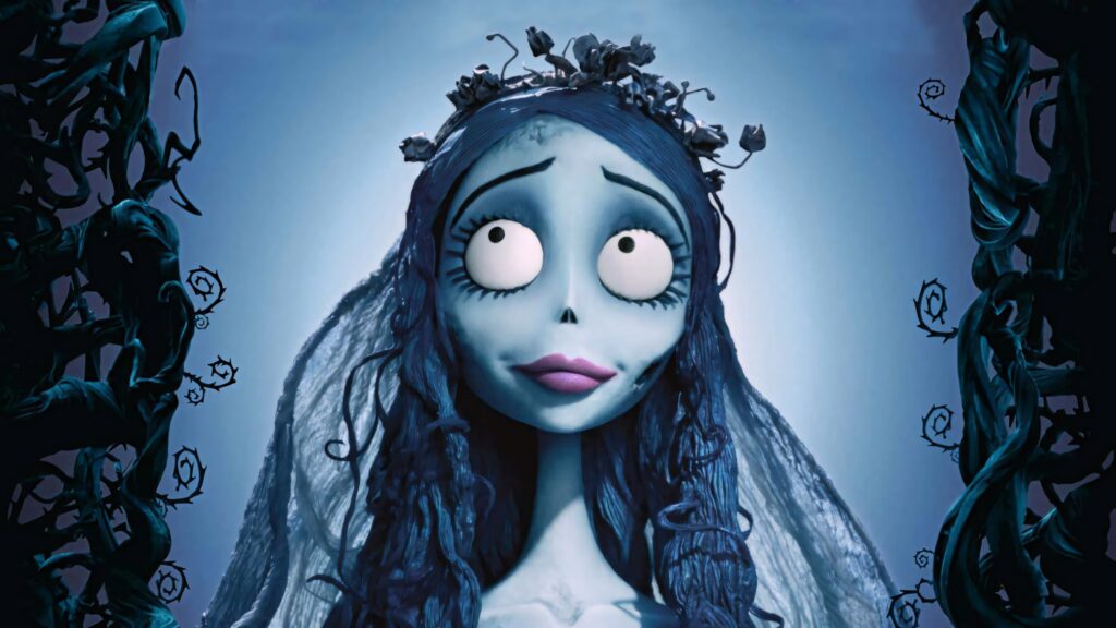 Emily the Corpse Bride with floral crown in vibrant blue gothic Tim Burton stop-motion scene Wallpaper