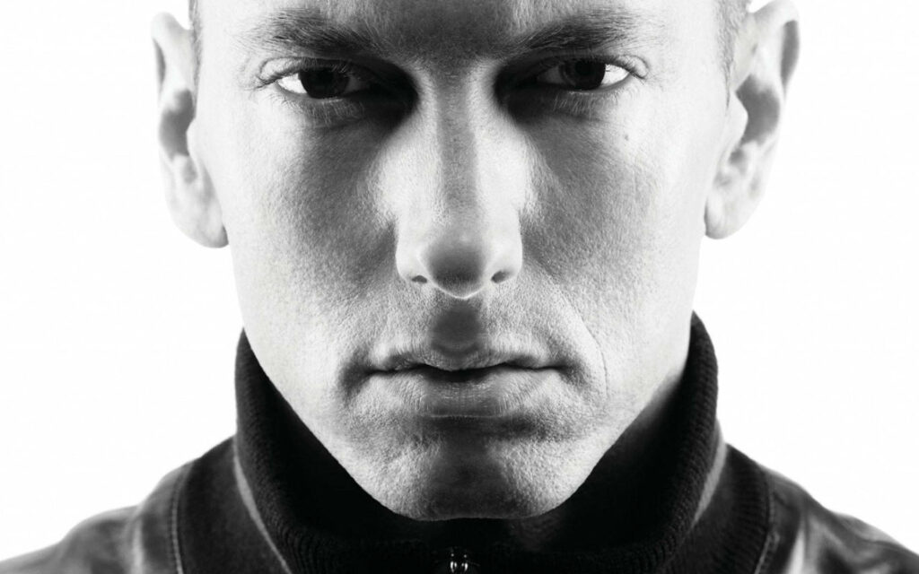 Black and white Eminem portrait close up intense expression signature style wallpaper background