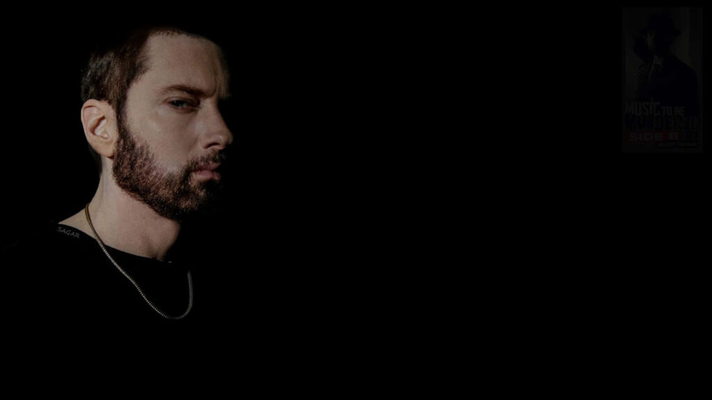 Eminem portrait wallpaper with intense gaze on minimalistic black background rap artist image