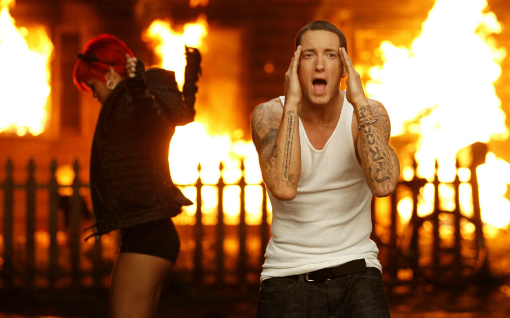 Eminem and Rihanna intense fiery background dramatic iconic music video moment wallpaper