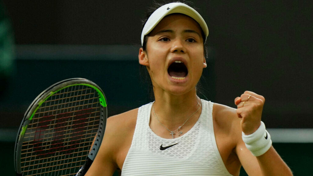 Emma Raducanu focused mid-match in dynamic tennis action with vibrant energetic background wallpaper