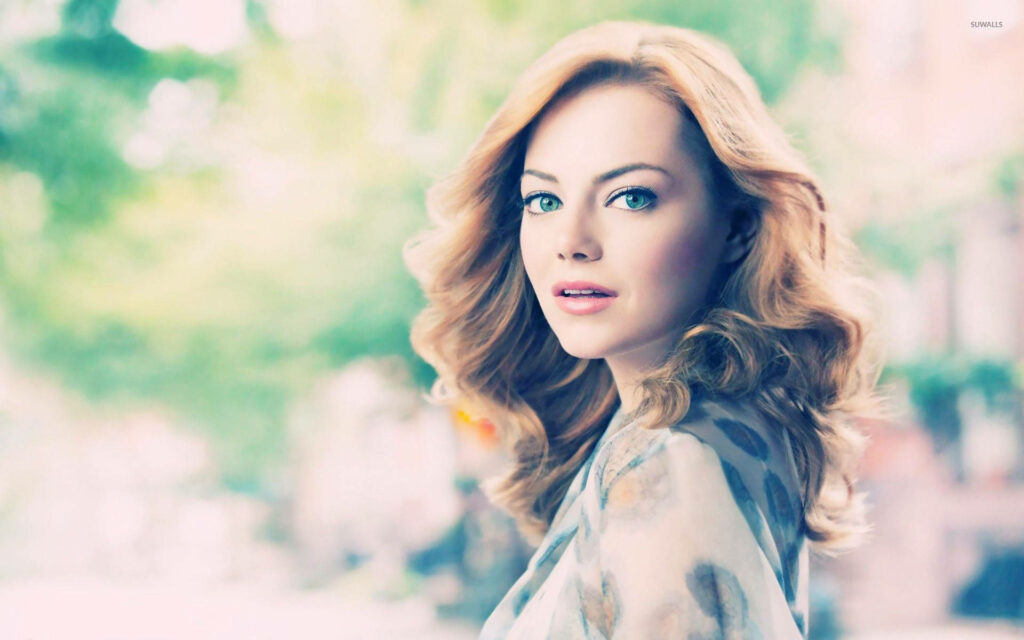 Emma Stone portrait with soft natural light dreamy pastel background and elegant curls wallpaper