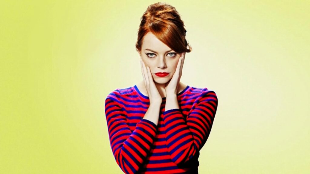 Emma Stone retro wallpaper red hair bold lipstick striped top soft yellow background stylish