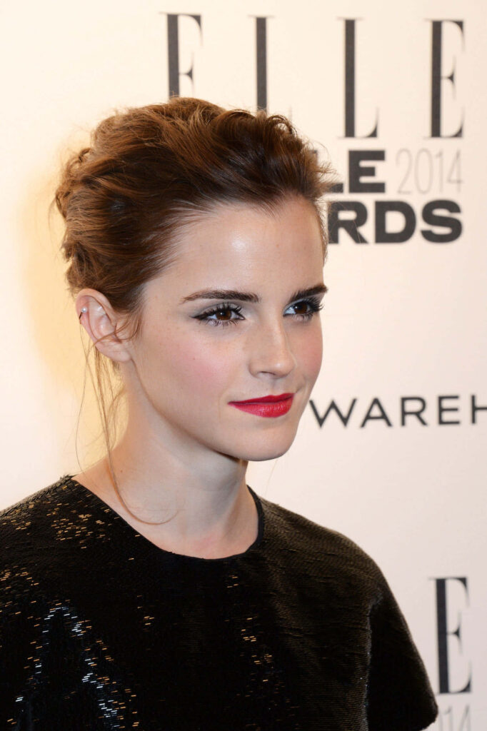 Emma Watson at 2014 ELLE Style Awards wearing black textured dress and bold red lipstick portrait Wallpaper