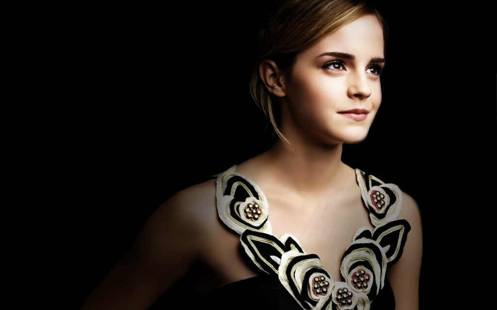 Emma Watson elegant portrait high resolution dark background floral dress serene expression Wallpaper