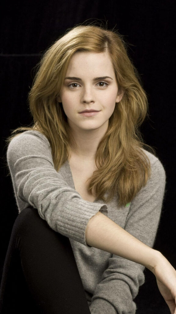 Emma Watson elegant portrait with soft waves natural makeup dark background casual outfit Wallpaper