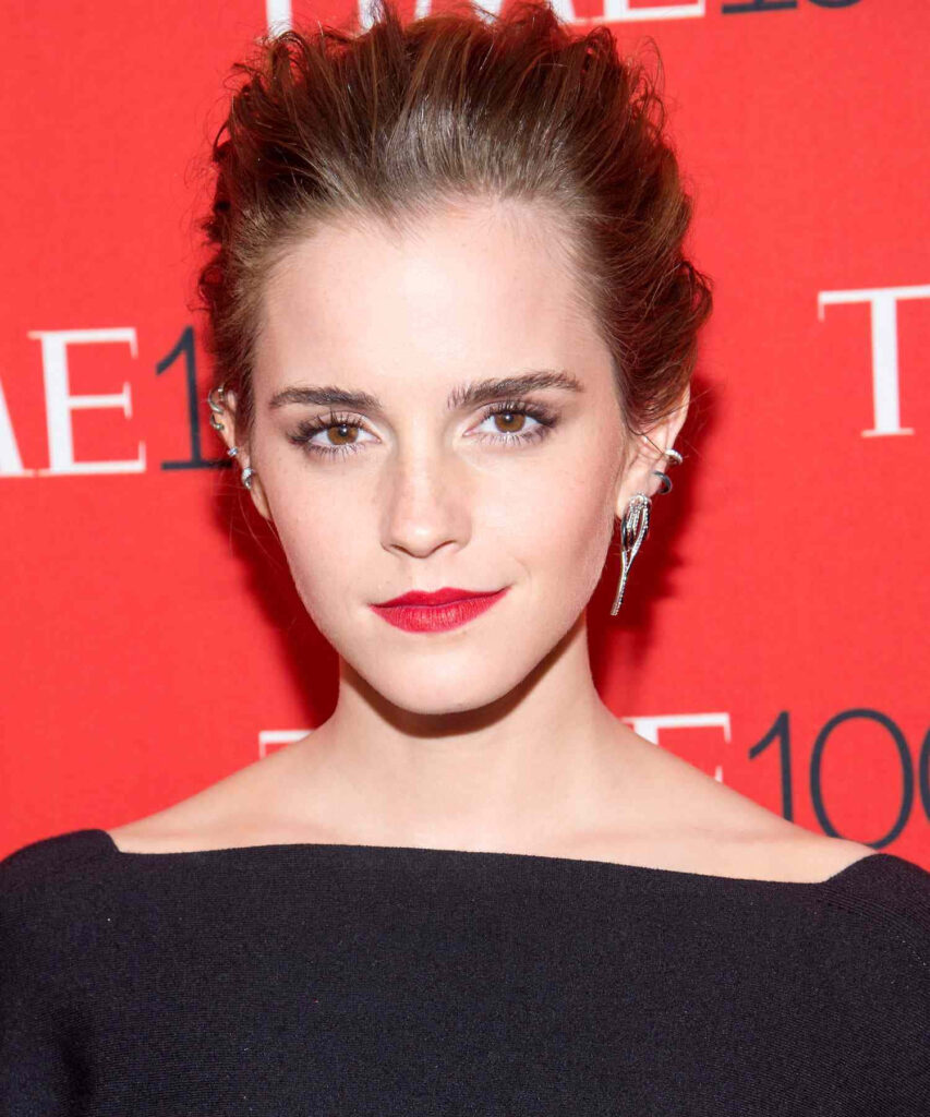 Emma Watson confident pose red background elegant updo striking red lips chic black outfit wallpaper