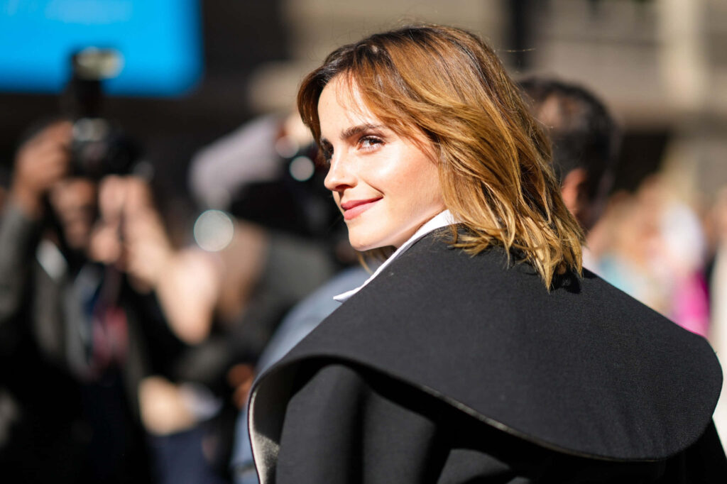Emma Watson smiling outdoors surrounded by photographers bright sunlight natural beauty wallpaper
