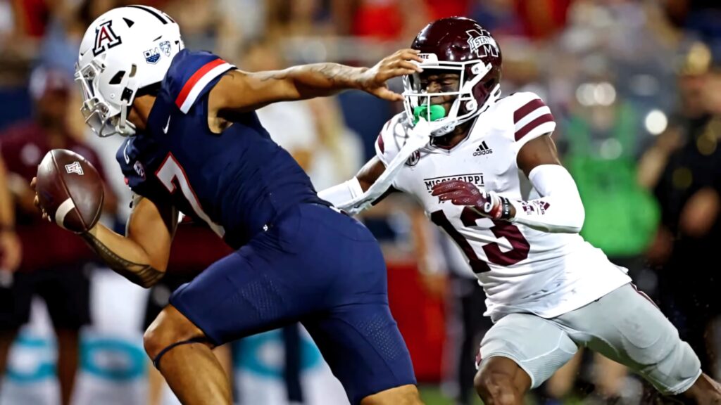 Emmanuel Forbes Jr in Mississippi State uniform chasing Arizona player showcasing football defense Wallpaper