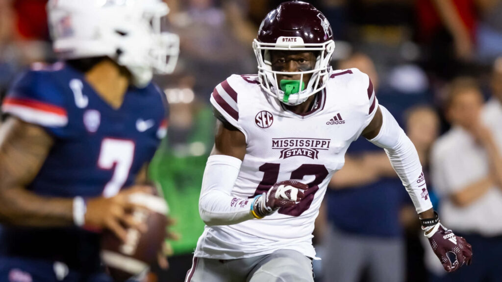 Emmanuel Forbes Jr Mississippi State football player in action defensive play maroon white uniform Wallpaper
