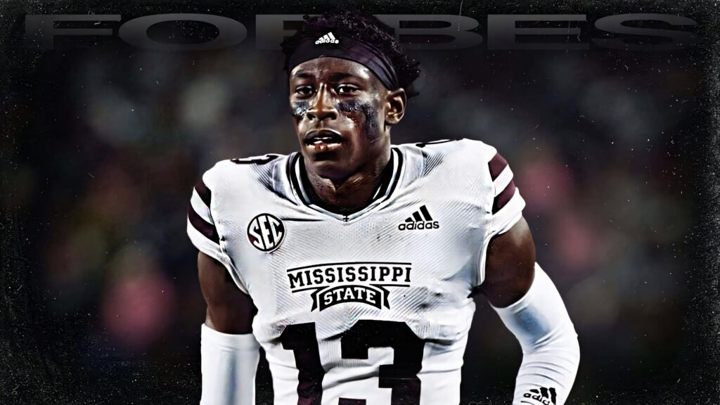 Emmanuel Forbes Jr in Mississippi State Football uniform with dramatic stadium lighting background Wallpaper