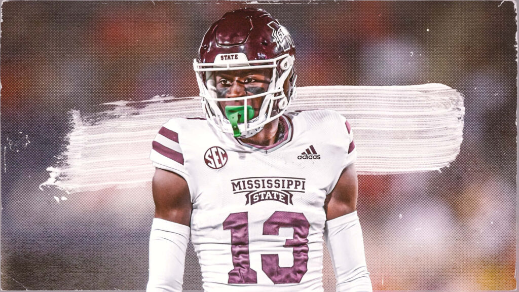 Emmanuel Forbes Jr in Mississippi State football jersey 13 intense focused pose maroon white design Wallpaper