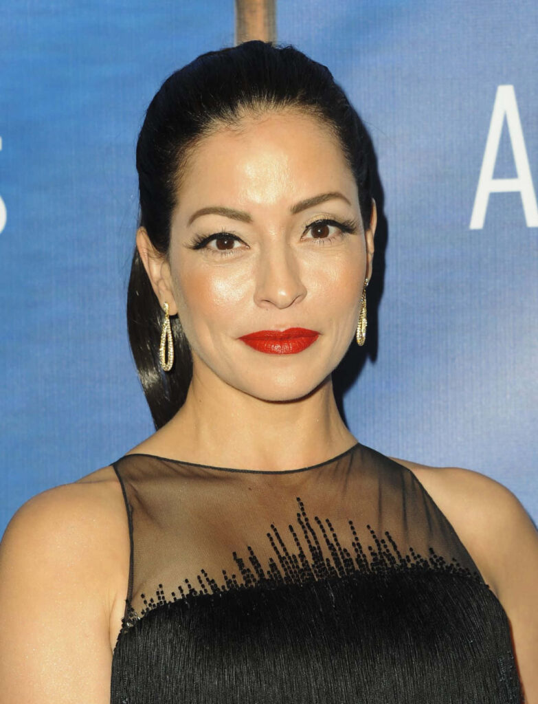 Emmanuelle Vaugier in sheer black dress gold earrings bold red lipstick elegant glamorous portrait Wallpaper