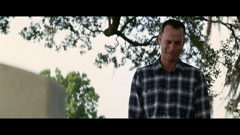 Emotional Forrest Gump Wallpaper: Sorrowful Reflection Scene