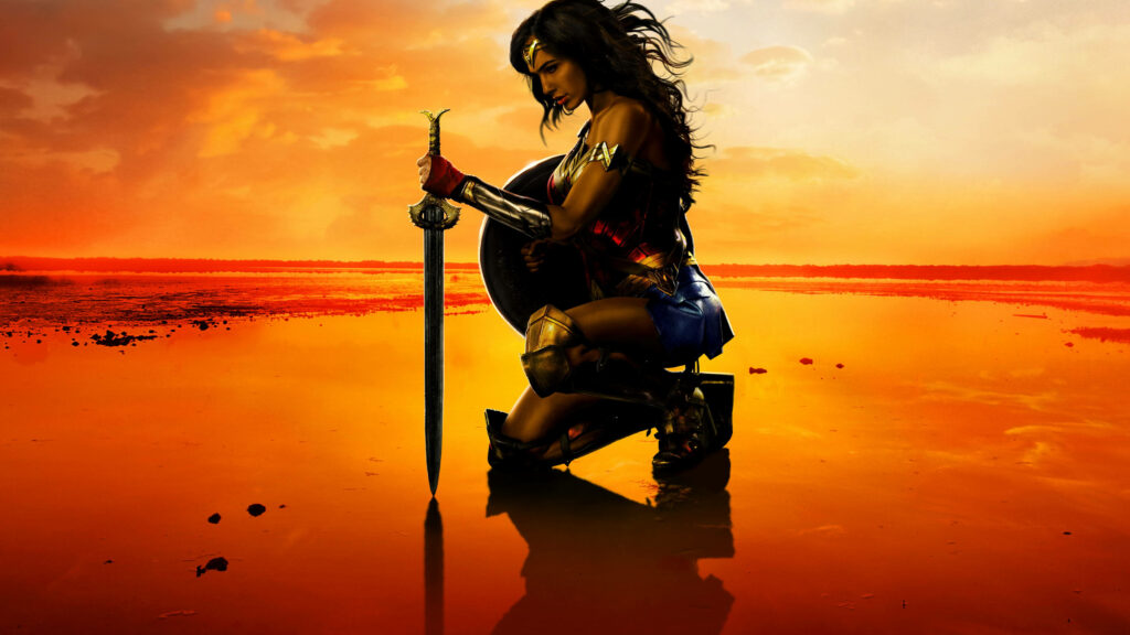 Empowered by the Sunrise: Wonder Woman's Beach Vigil Wallpaper