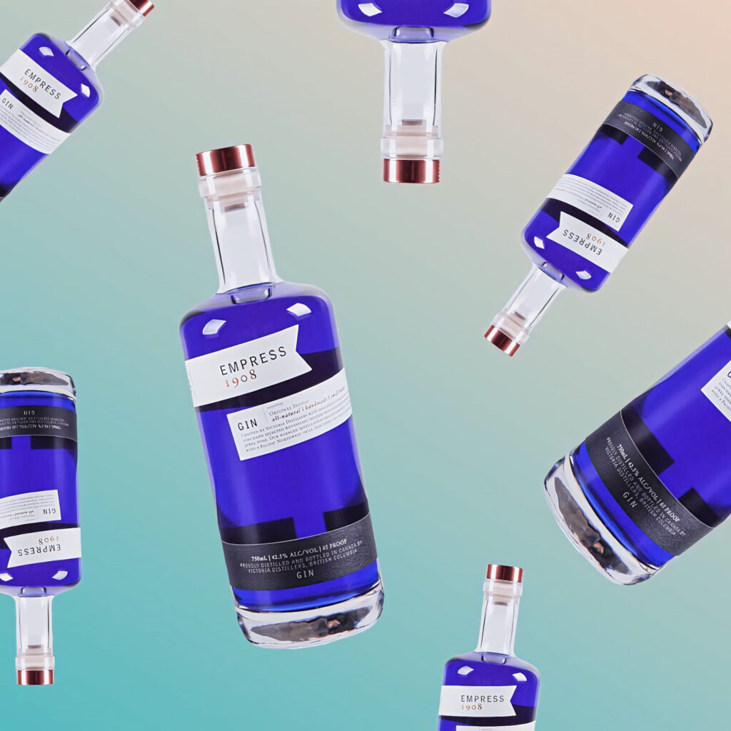 Collage of Empress 1908 Gin deep indigo bottles on soft gradient background wallpaper design