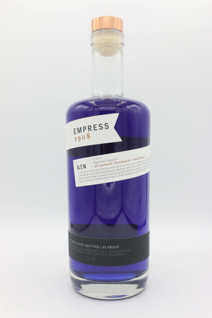 Empress 1908 Gin bottle with rich indigo liquid on minimalist stylish wallpaper background